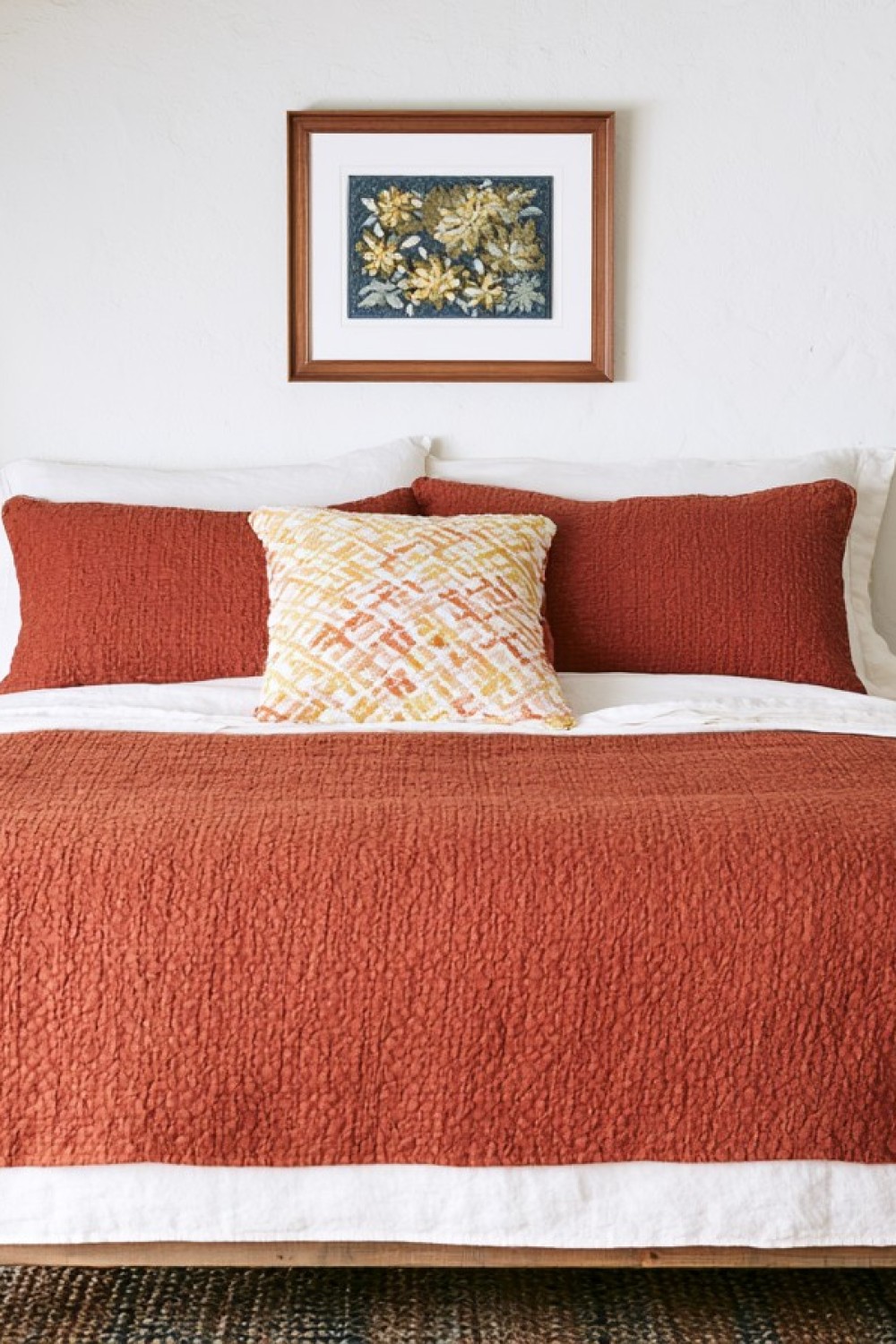 Mediterranean attic bedroom with terracotta and plaster-inspired finishes