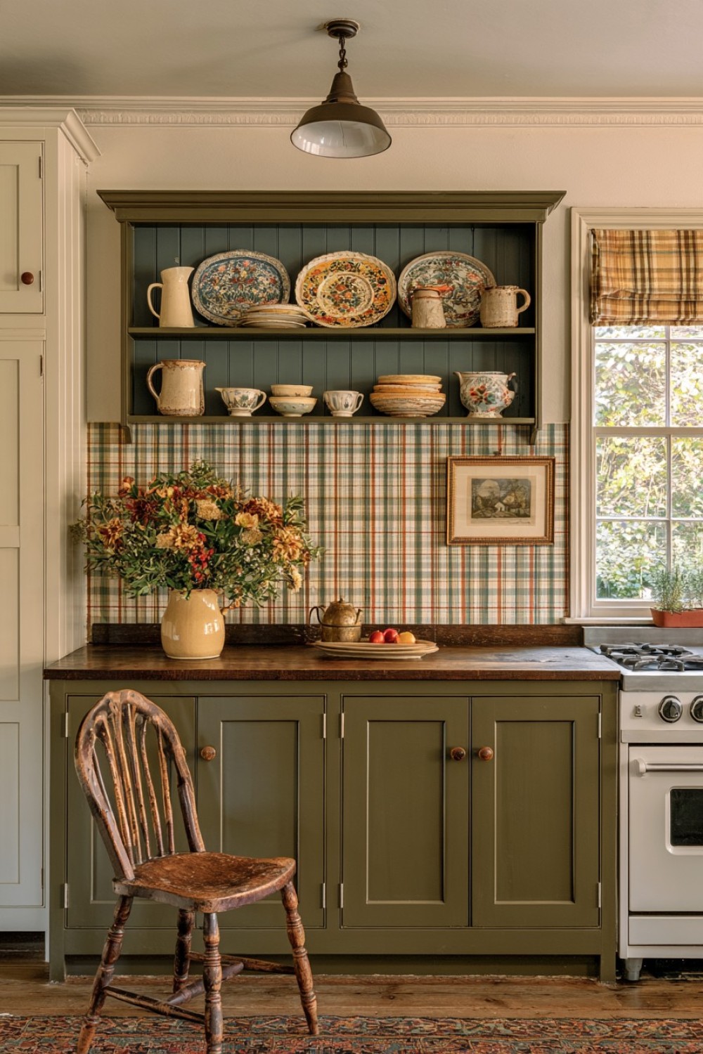 Small corner niche displaying ceramics in a cottage kitchen