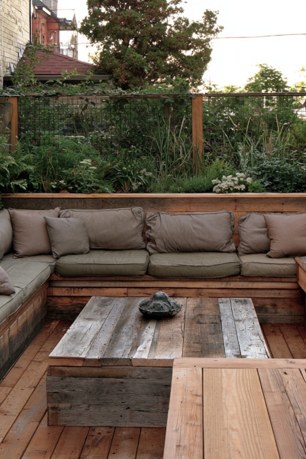 Budget wooden corner bench built for a compact patio