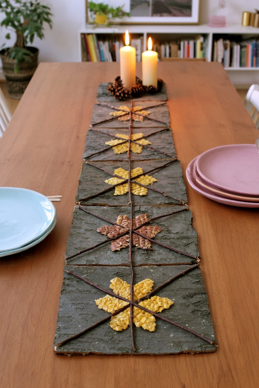 Low bark and twig table runner with repeated botanical motifs
