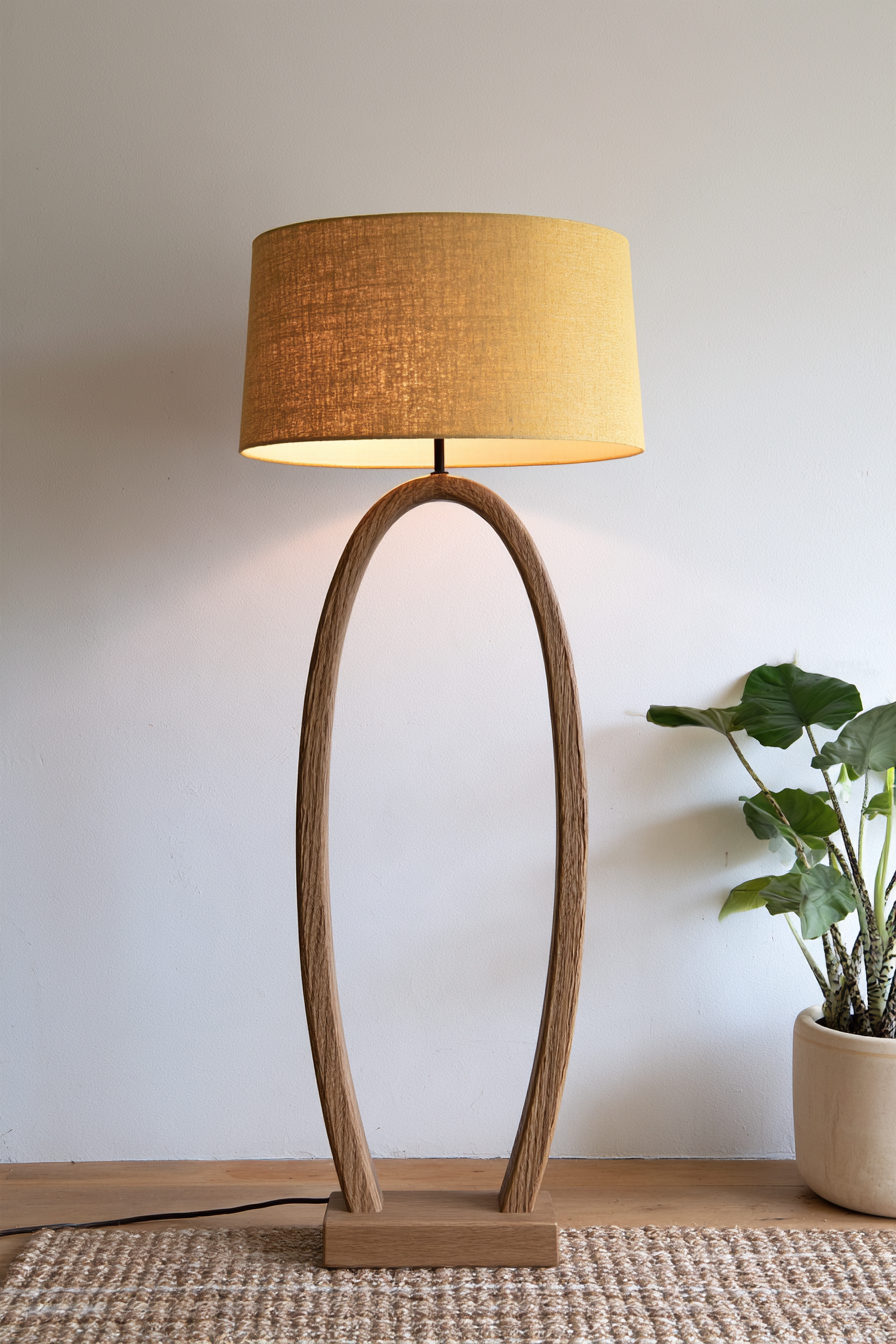 Wood floor lamp showing curved frame and base