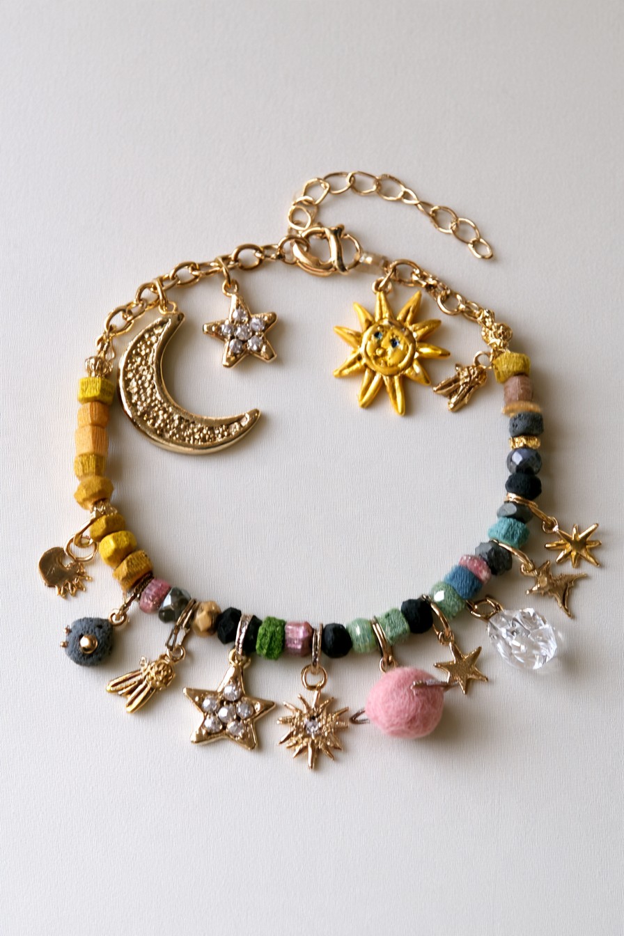 Celestial charm bracelet with moons stars suns beads and colorful details