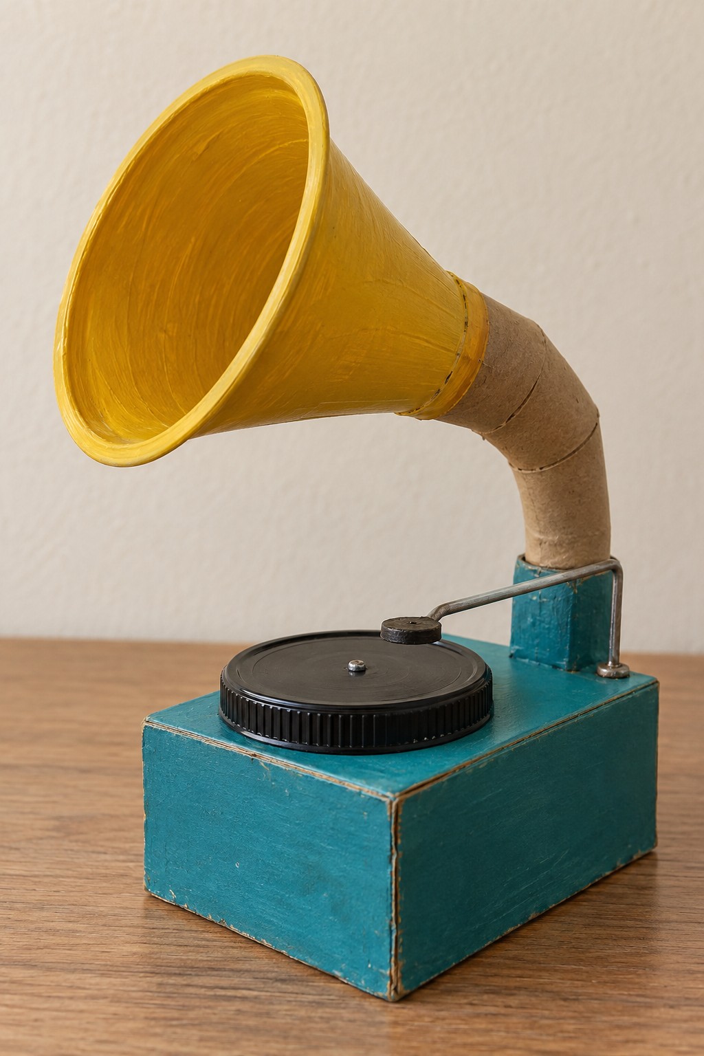 Decorative miniature gramophone with a turquoise cardboard box yellow paper cup horn and black lid record