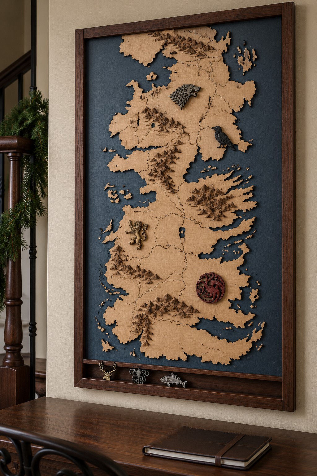 Tall framed wooden fantasy map on a dark blue background with raised mountains, animal emblems, and a narrow lower ledge