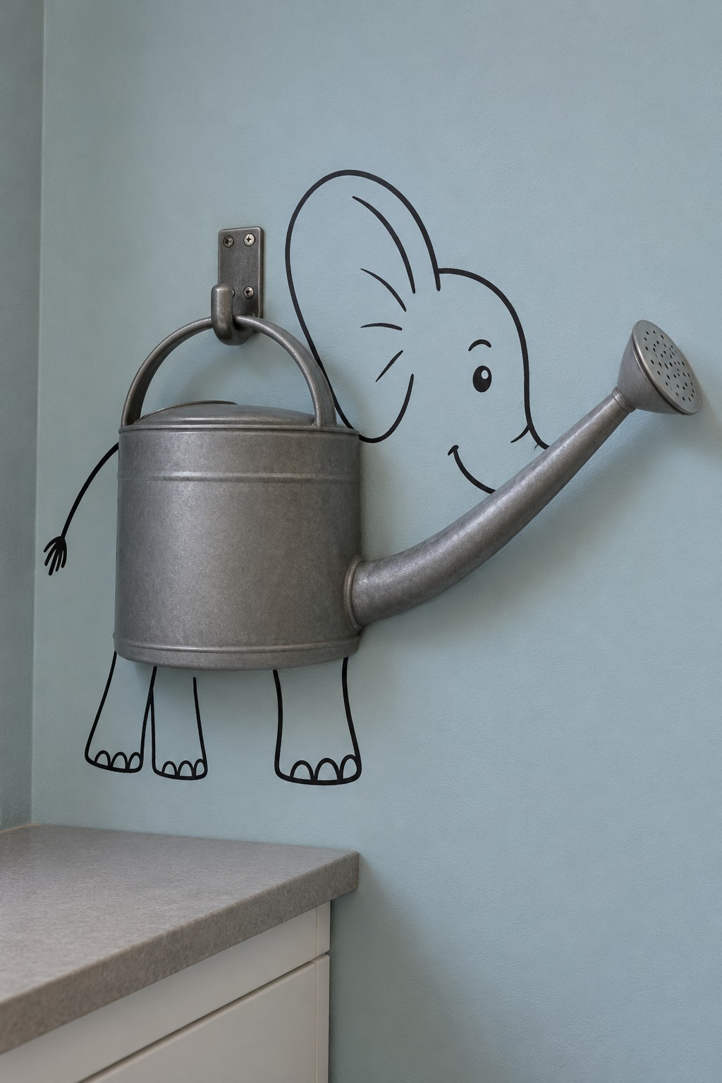 Galvanized watering can forming an elephant body and trunk with a painted head, legs and tail