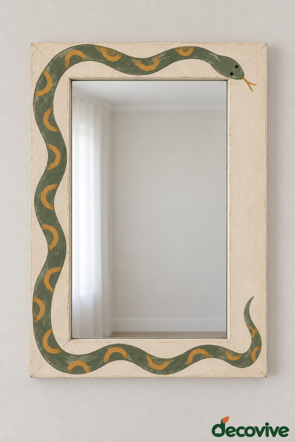 Cream rectangular mirror frame with a green snake and muted gold markings winding around its border
