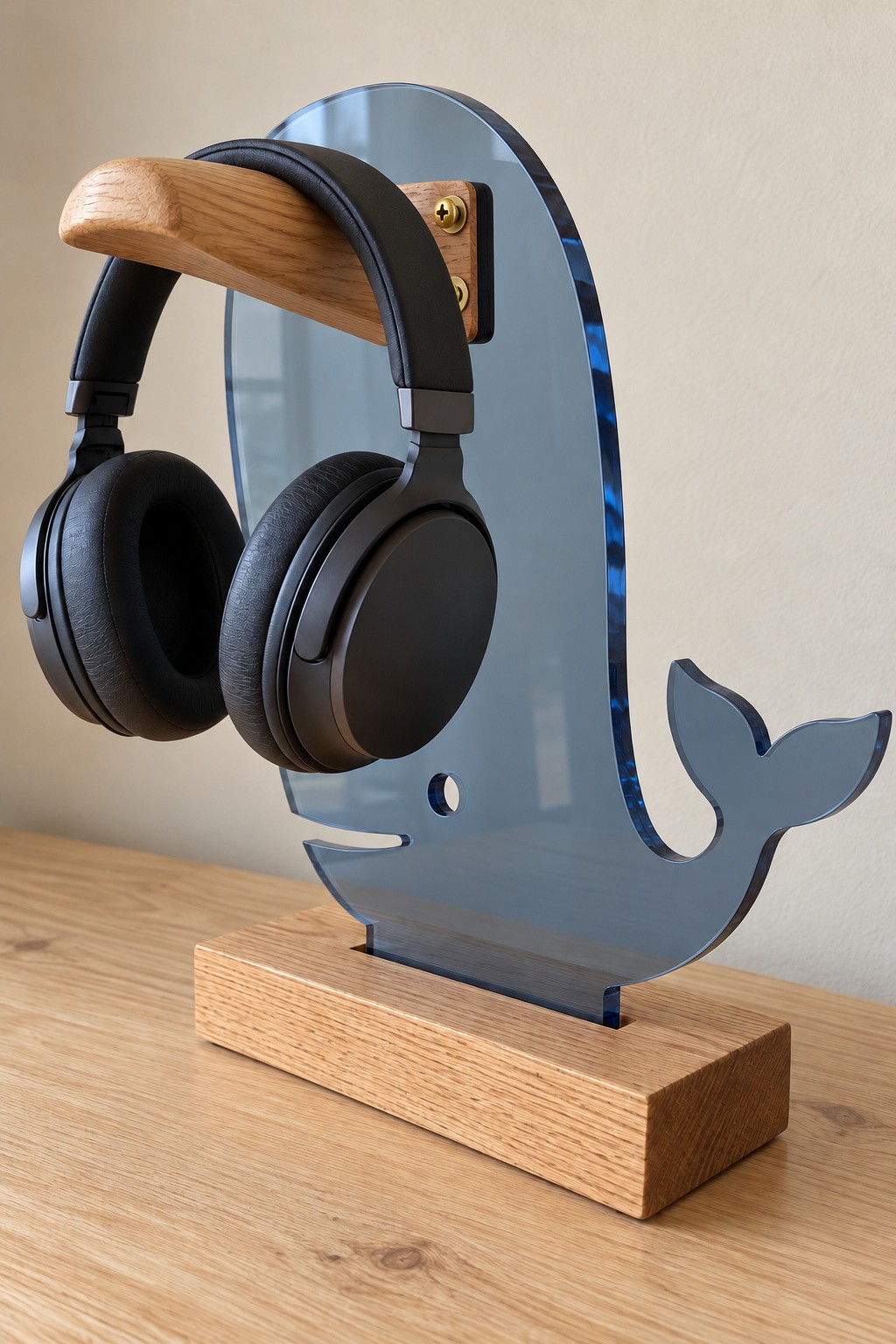 Smoky blue acrylic whale headphone stand with a wooden headband rest and timber base