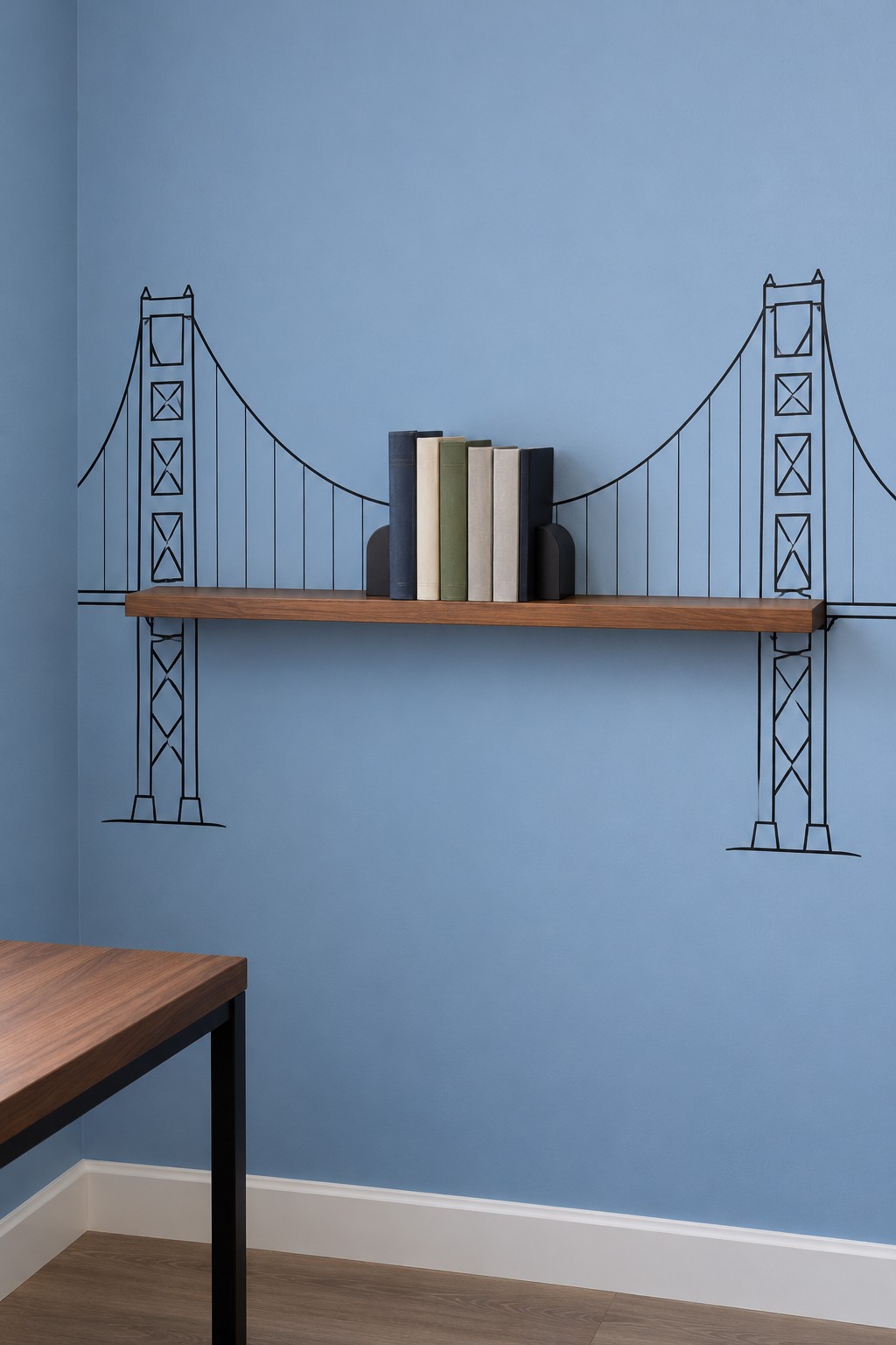 Wooden floating shelf forming the roadway of a suspension bridge drawing on a blue wall