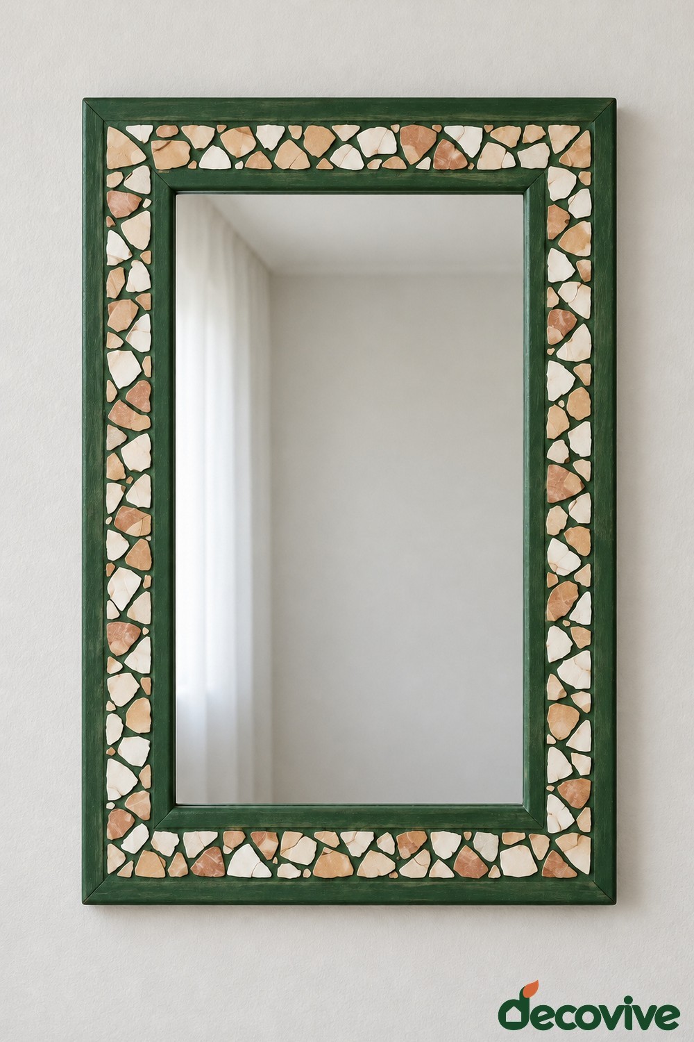 Rectangular forest green mirror frame with pale cream and blush ceramic mosaic pieces