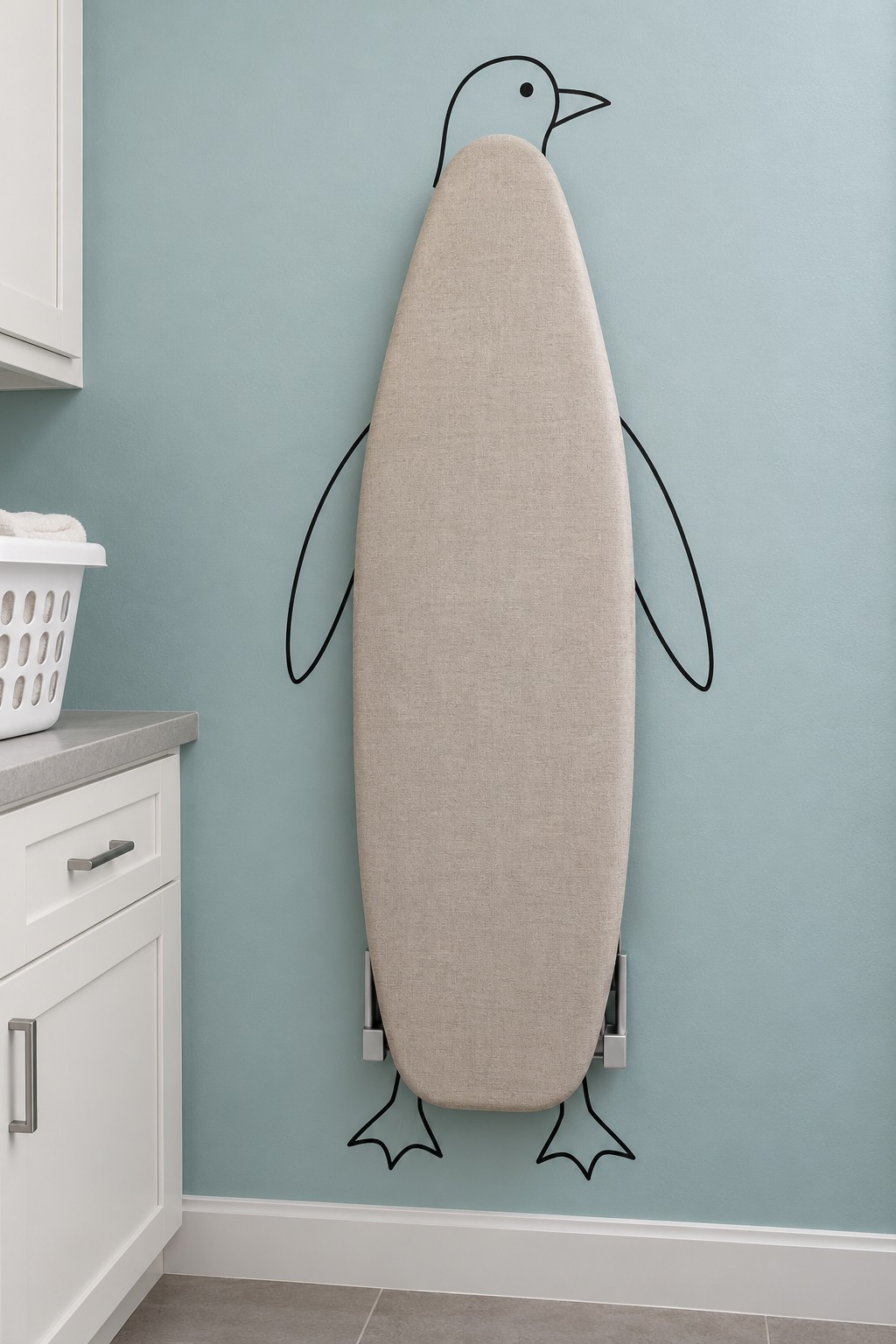 Upright folded ironing board forming a penguin body with a painted head, flippers and webbed feet