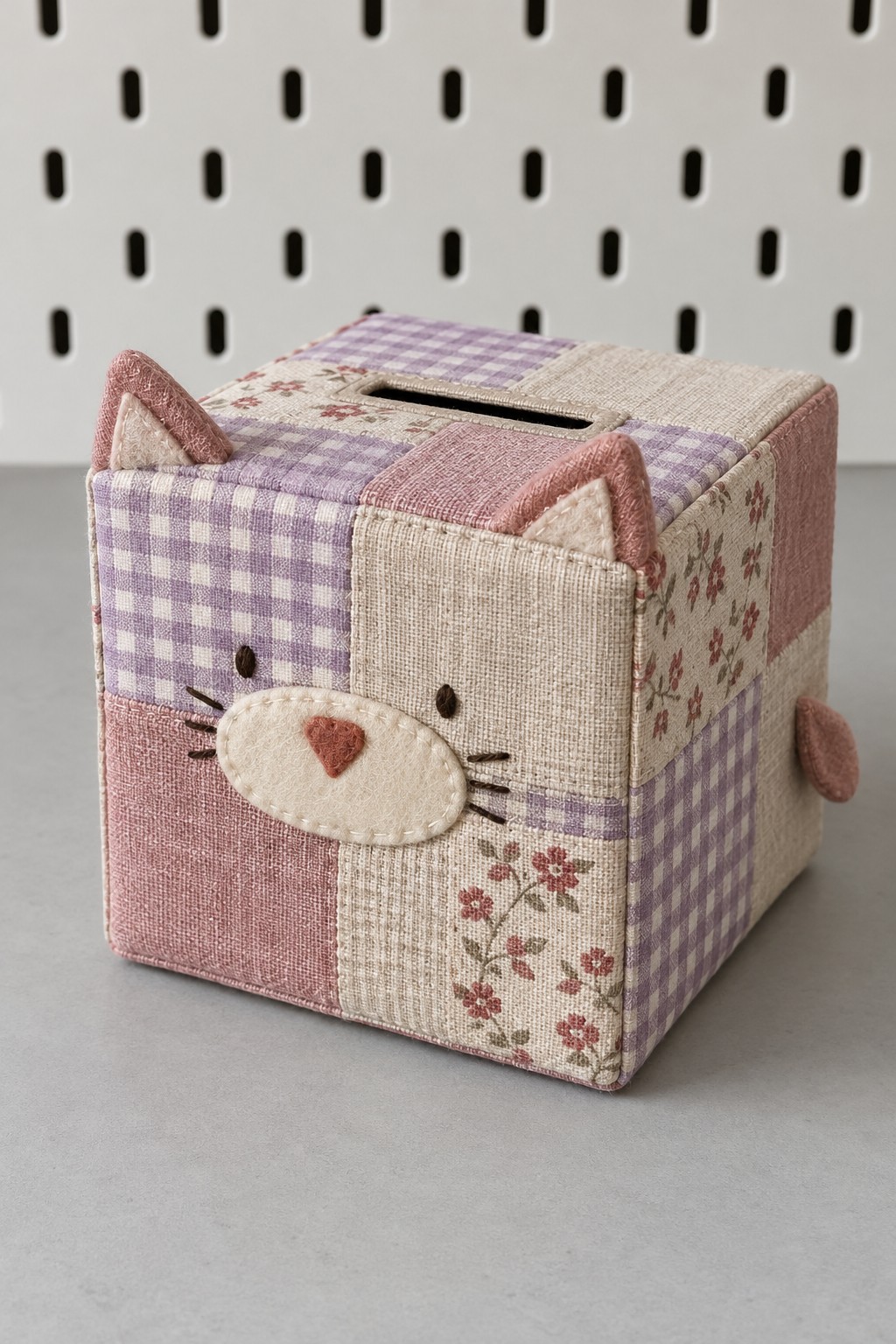 Patchwork cat cube bank with lavender gingham, cream floral cloth, pink ears and a felt muzzle