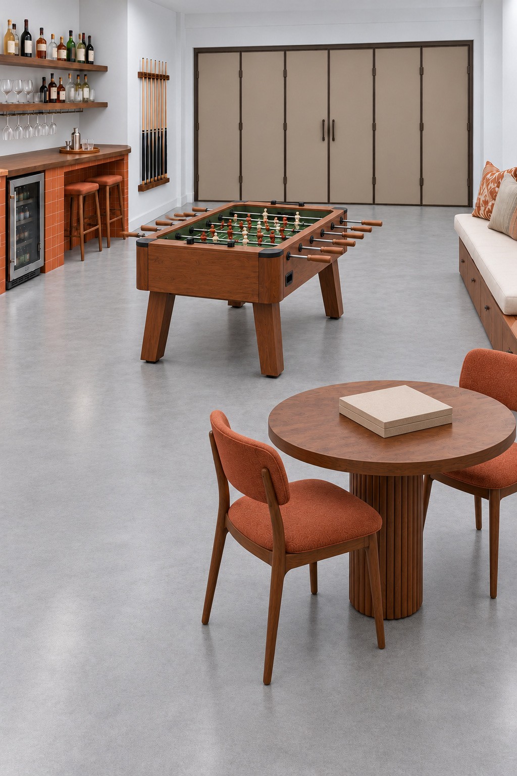 Garage games room with a wooden foosball table, round board game table, orange tiled bar, and wall bench