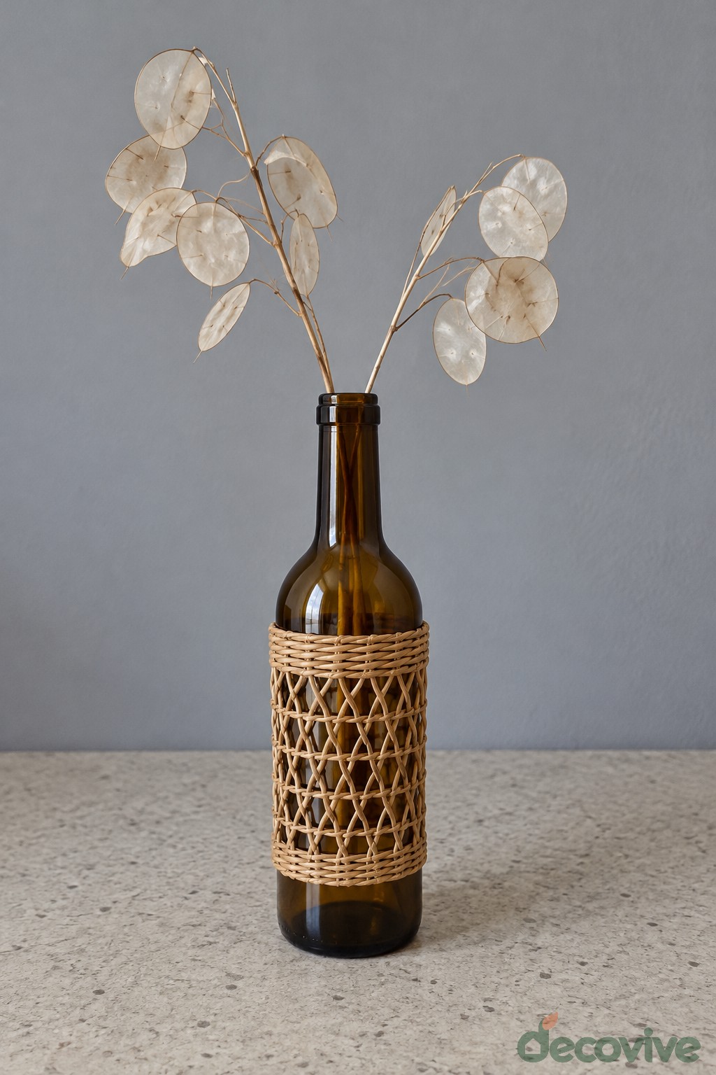 Cane Wrapped Amber Bottle Vase