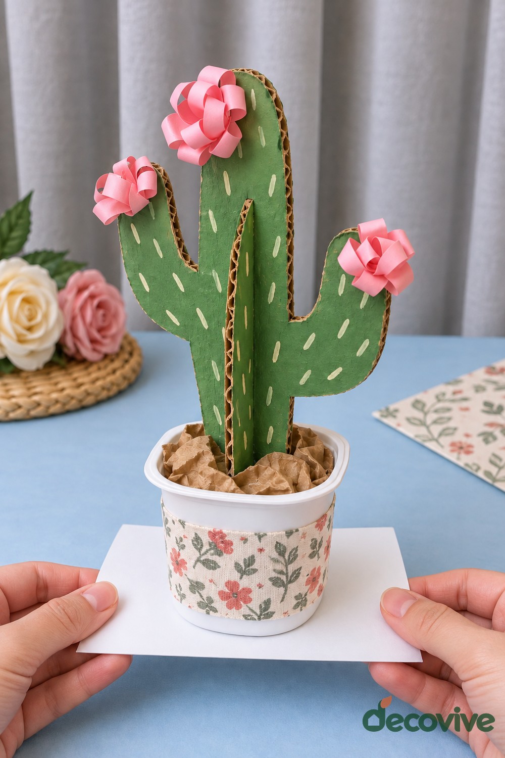 Finished flowering cardboard cactus in a paper pot