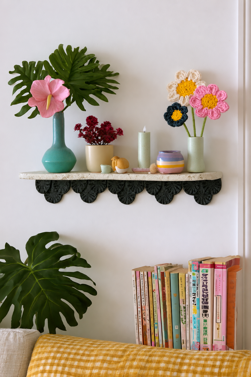 Scalloped display shelf with colorful vases and a flameless pillar candle