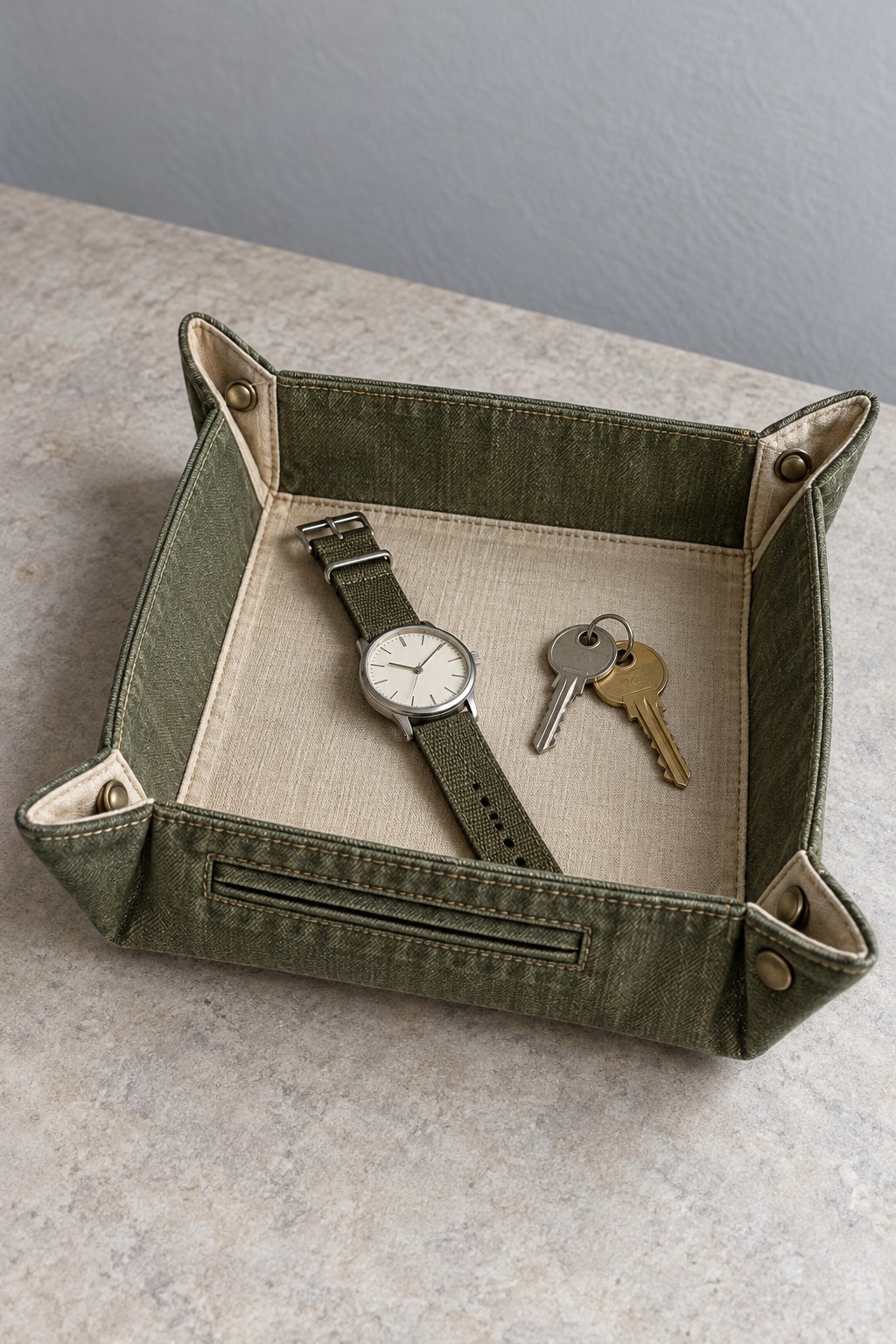 Olive rectangular fabric tray with cream lining and folded upright corners
