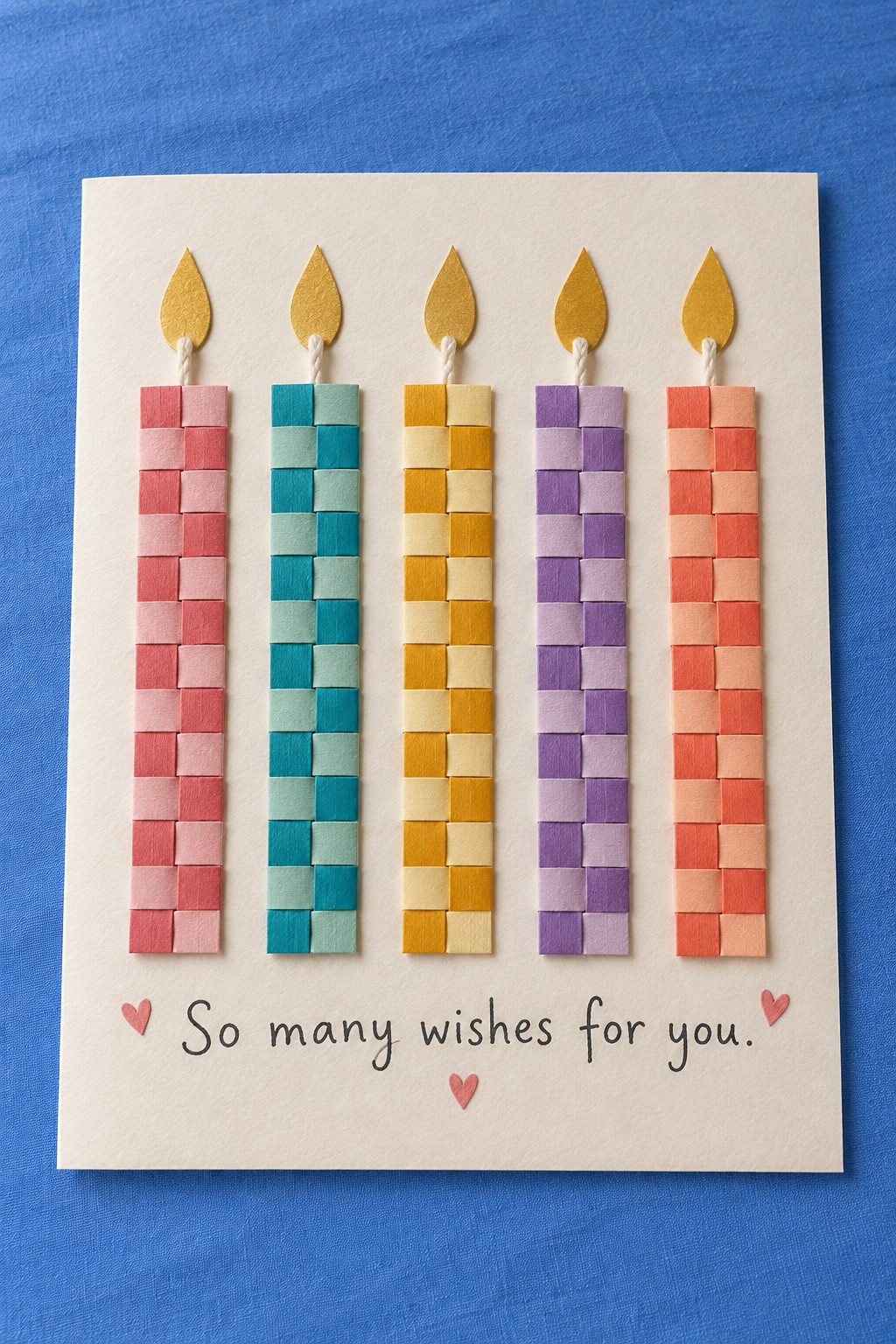 Cream birthday card with five checkerboard paper candles and yellow paper flames