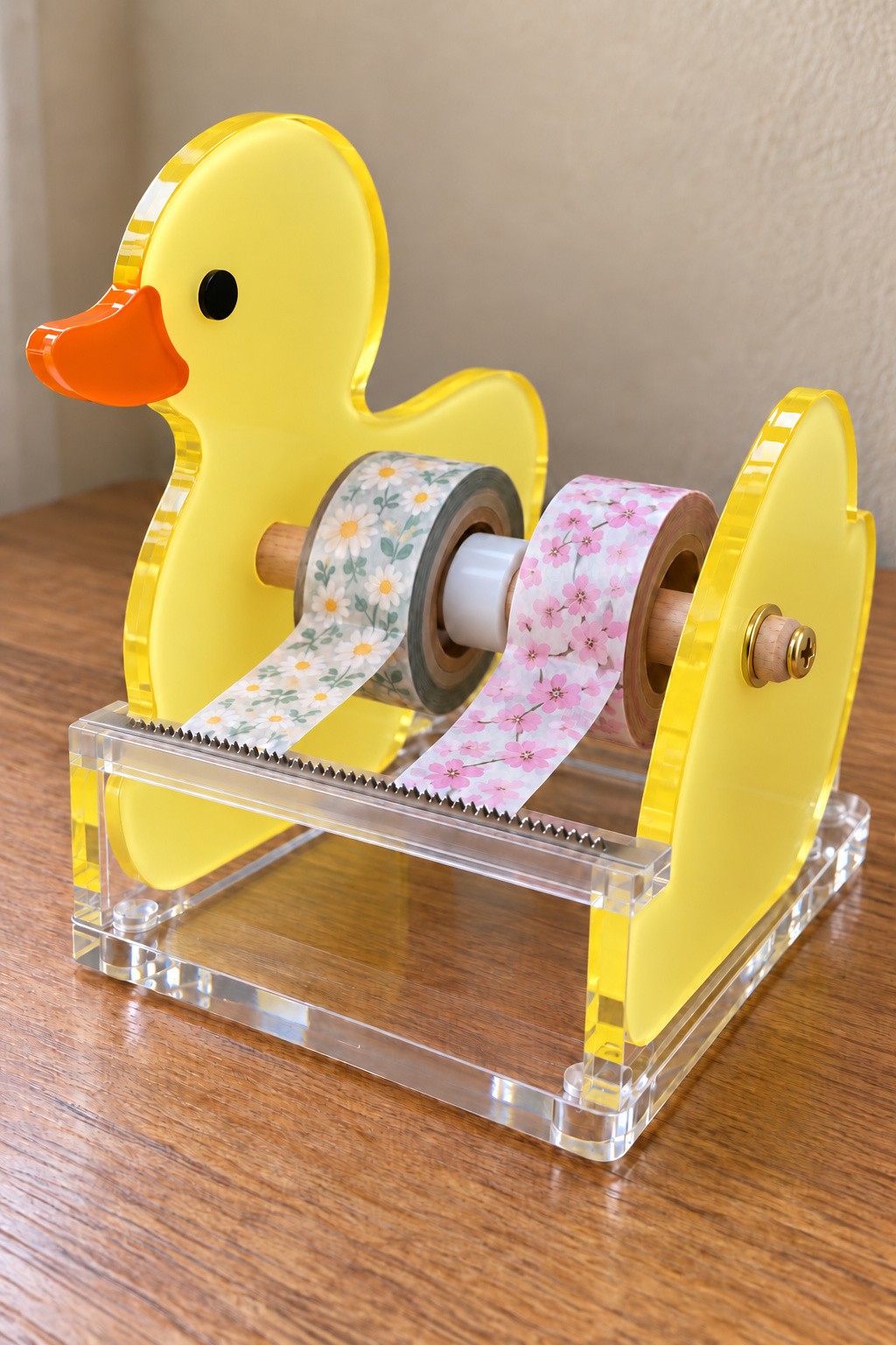 Yellow duck acrylic washi tape dispenser with two tape rolls and a front cutting strip