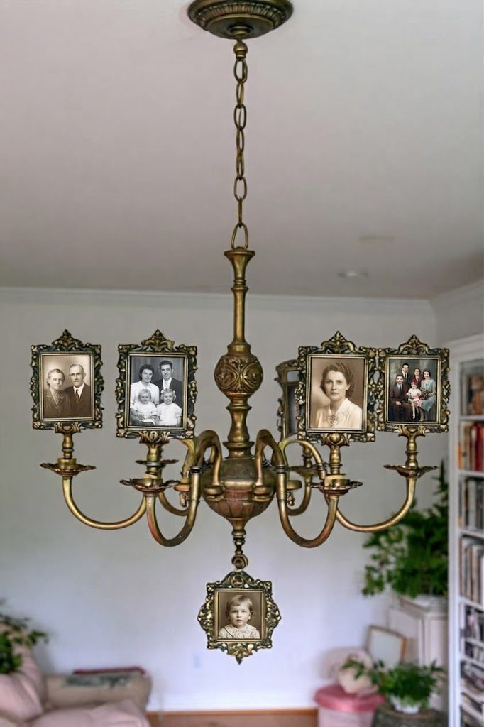 Brass chandelier displaying vintage family photos in ornate frames on each arm
