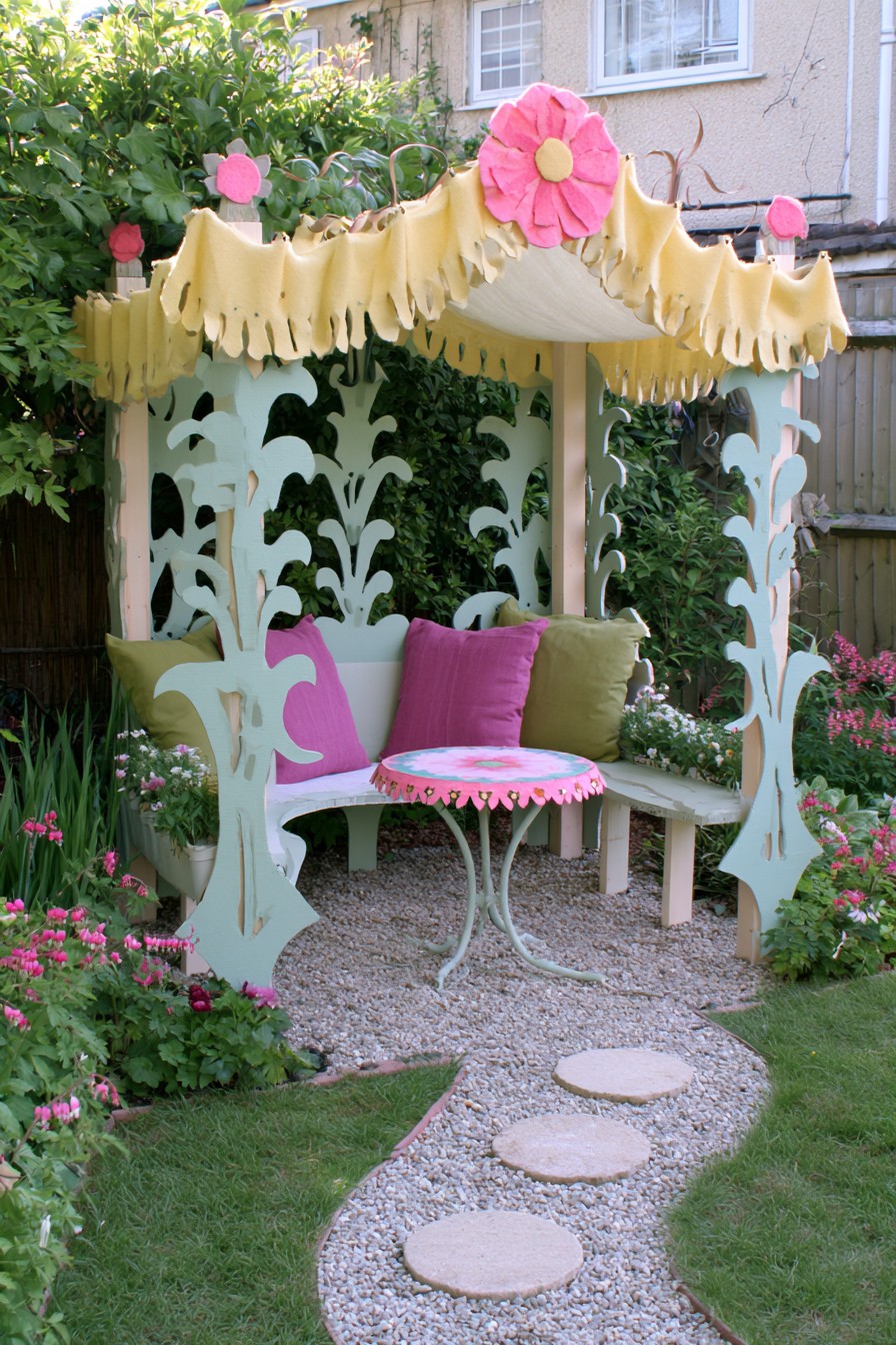 Pale botanical cutout screens around a corner bench beneath a yellow canopy