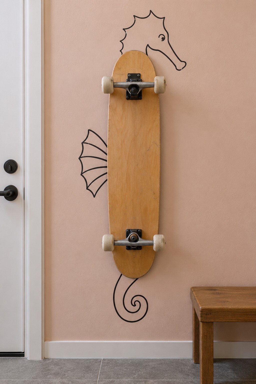 Wooden longboard mounted vertically between a painted seahorse head, side fin and curled tail