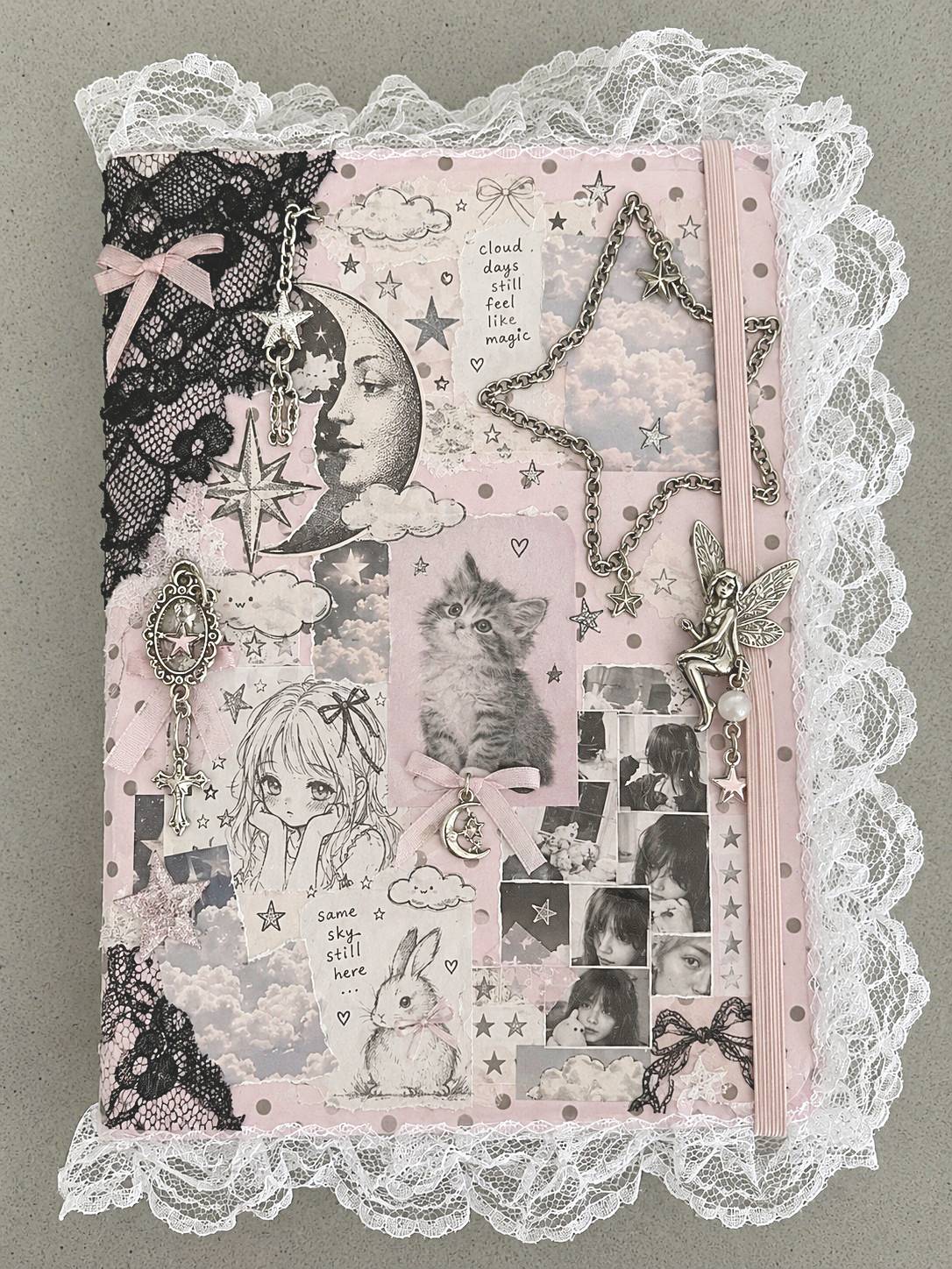 Pale pink celestial collage sketchbook with moon and cat illustrations, lace, and a metallic star outline