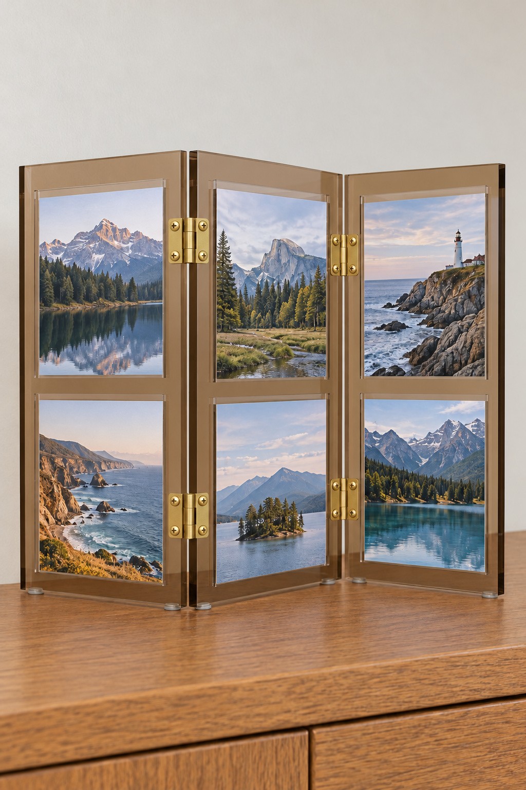 Three panel hinged amber acrylic tabletop screen displaying six landscape photographs
