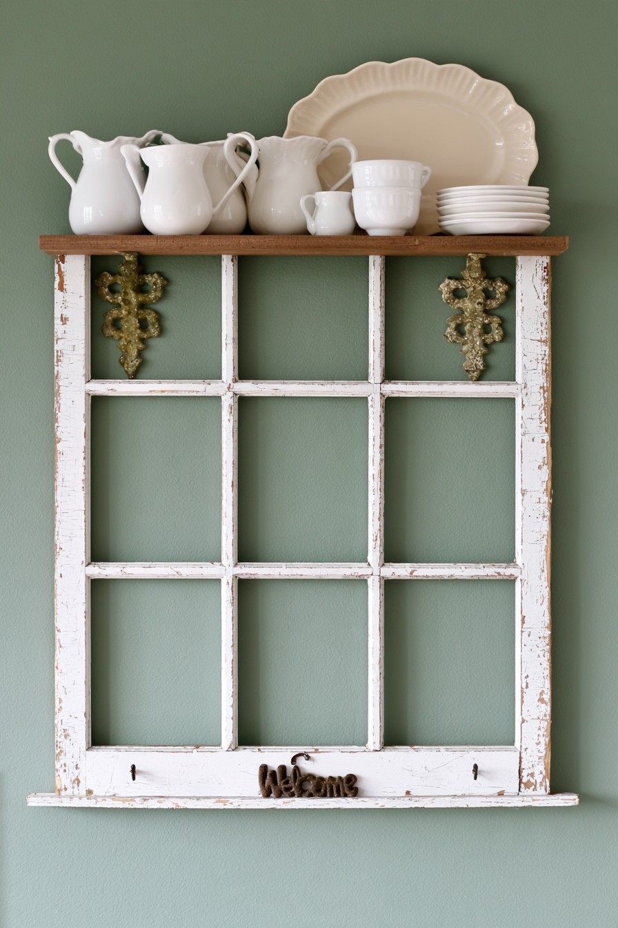 Old window frame with a farmhouse kitchen display shelf