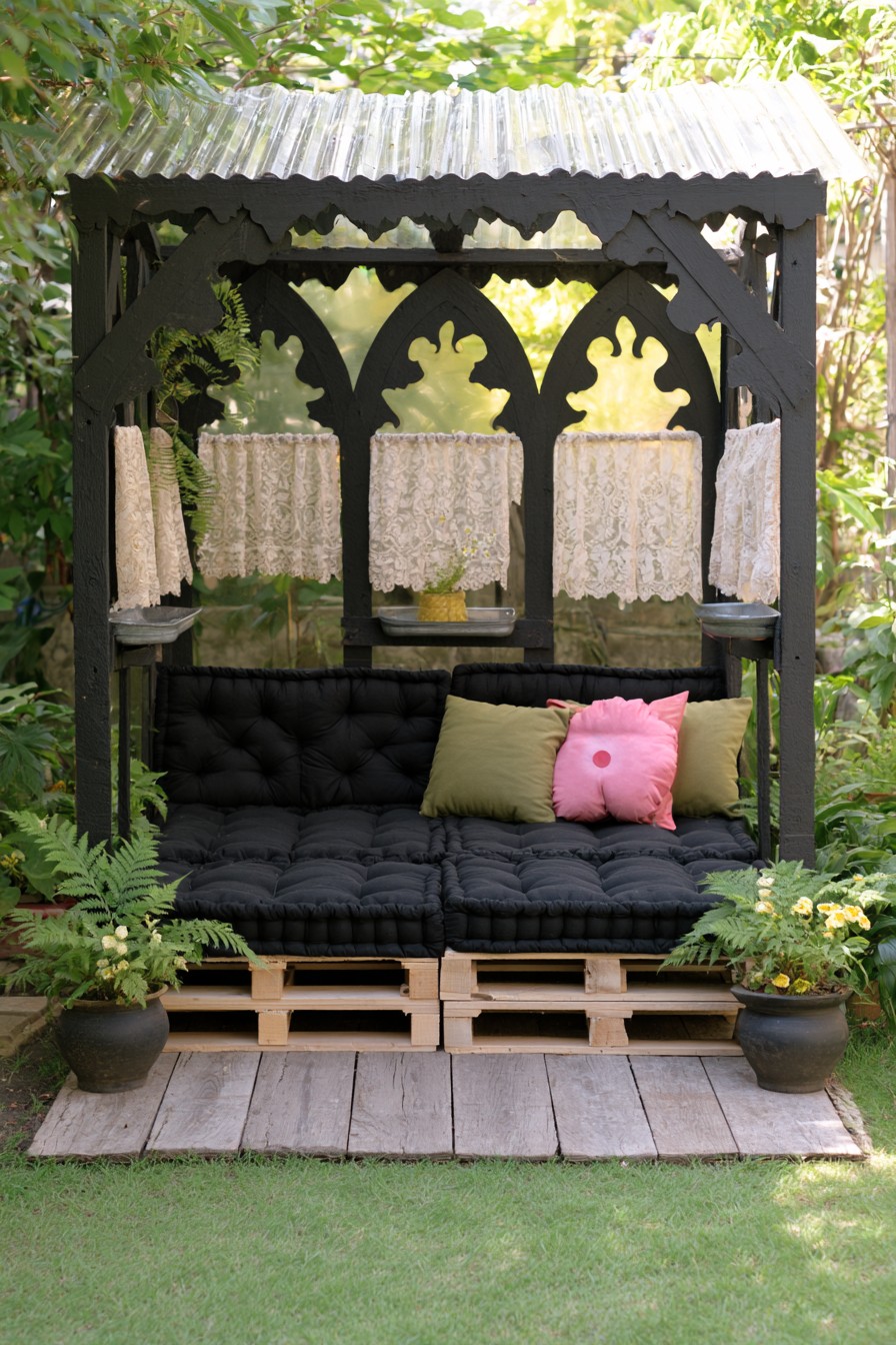 Pointed black arches above a tufted daybed with short lace screens and a corrugated roof