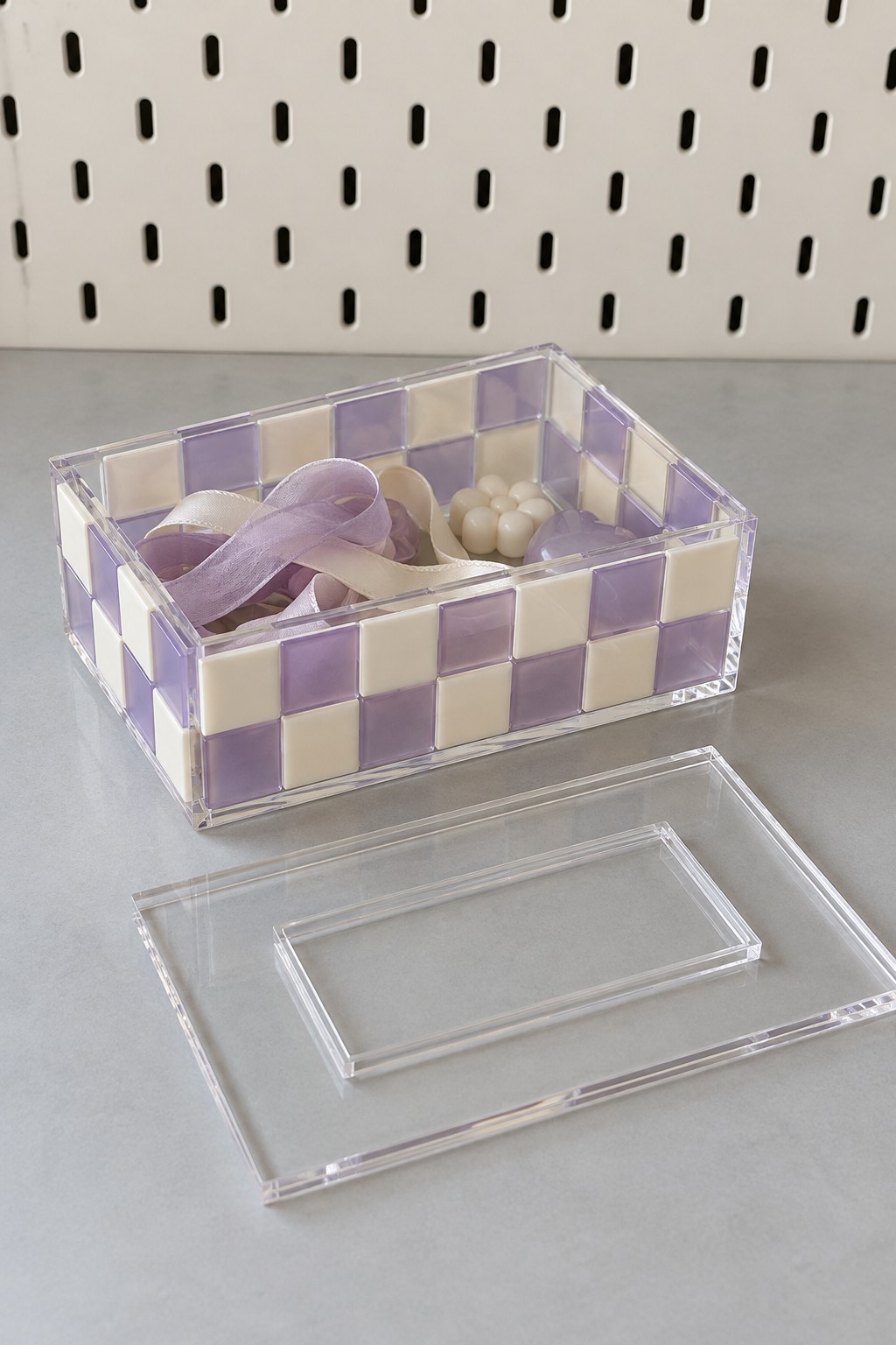 Lilac and cream checkerboard acrylic accessory box with its clear lid removed
